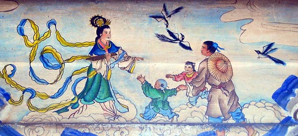 color drawing of a woman in very traditional Chinese clothing reaching out to a man dressed in similar style; birds fly around them, and two children run toward the woman; all (except the birds) are standing on clouds