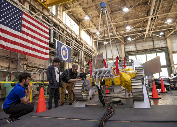 A test version of the VIPER lunar rover rolls down the ramp of Astrobotic's Griffin lander replica at NASA's Glenn Research Center in Cleveland, Ohio.