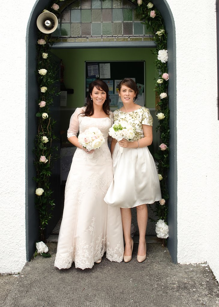 Flowers were a strong element of this wedding The beautiful floral arch 