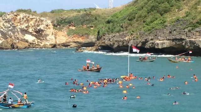 See the Flag Ceremony in the Middle of the Sea Baron Beach, Yogyakarta