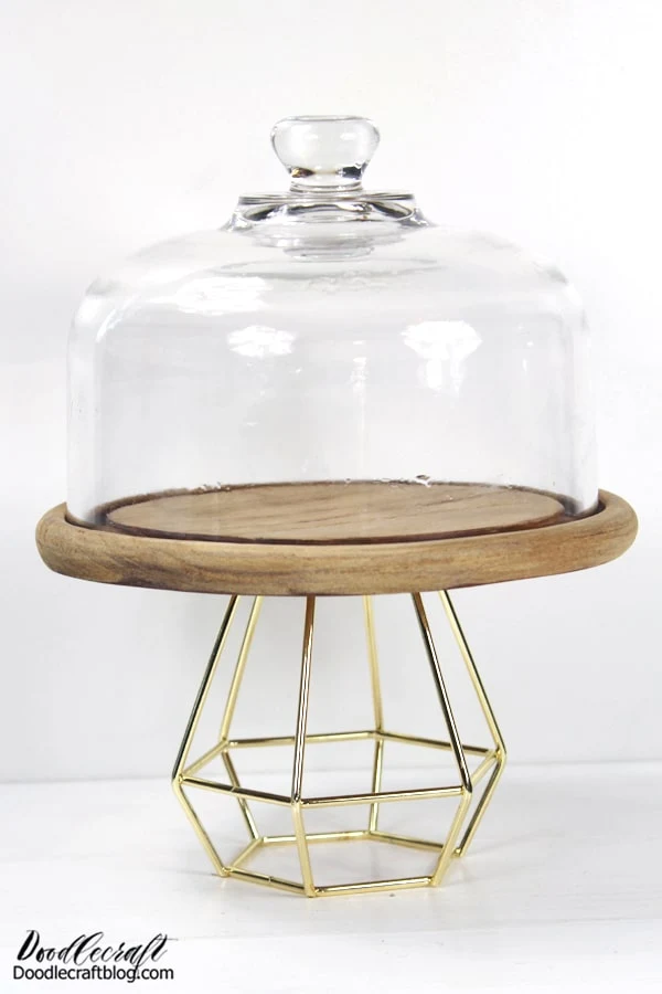 Geometric Cake Stand DIY with Tealight Holder Upcycle a few items to make a geometric cakestand, perfect for parties and home decor. This fun DIY just needs a glass cloche and a tea light holder.   Perfect for holiday entertaining and it just takes a few minutes to assemble.