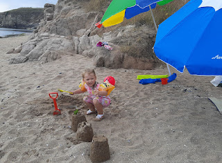 Rosie and some of her sandcastles