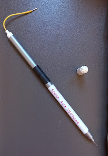 A high voltage probe with very high impedance is built and inserted into the plastic tubes of felt-tip markers.