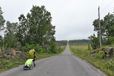 Sean Morton hiking roadway stretch of Trans Canada Trail to Echo Bay.