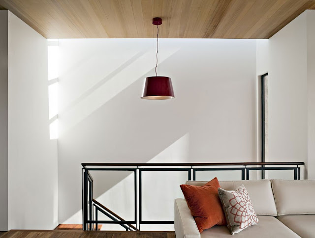 Red lamp above staircase 