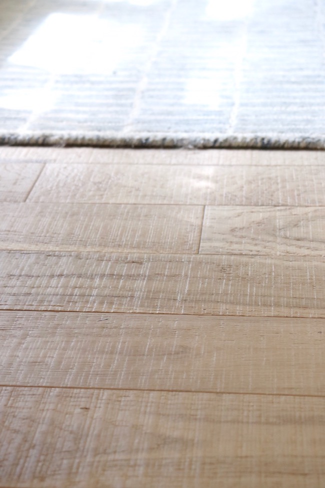 Even though the French Country Hardwood Floor in the bedroom is distressed, the finish on the floor makes it comfortable for walking barefooted.