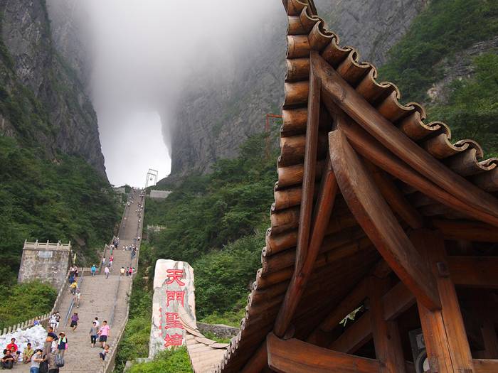 Jutting out from a sheer cliff 1,430 meters high, the glass skywalk in Zhangjiajie National Forest Park offers sightseers terrifying thrills and clear view of the mountains below as they tread nervously across the 60 meter long bridge encircling the vertical cliffs of Tianmen Mountain in Hunan province. The 3ft-wide, 2.5in thick glass walkway is so scary that sightseers are requested to wear cloth slip-ons over their shoes when they cross the skywalk, presumably to make the job easier for the cleaners.