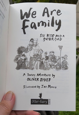We Are Family by Oliver Sykes inside cover with drawing of large family as if ready to get into position for a photo