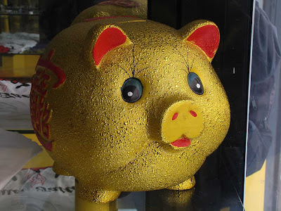 Piglet with Chinese characters in a tattoo parlor, Livorno