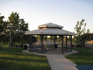 Paved walkway leading to a gazebo with benches.