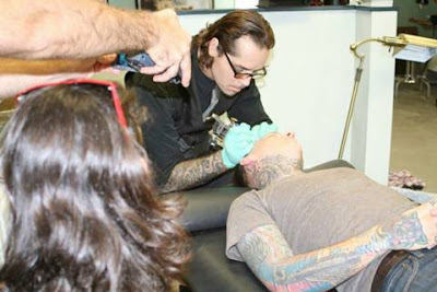 A Guy Gets His Face Tattoed