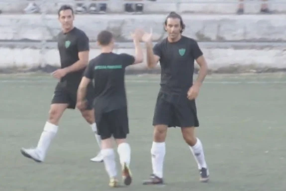 Robert Pirès celebrates after scoring a goal with his news 'teammates'