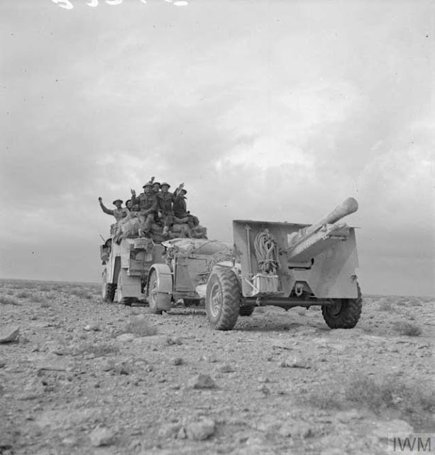 A Quad artillery tractor towing a 25-pounder gun, 22 December 1941 worldwartwo.filminspector.com