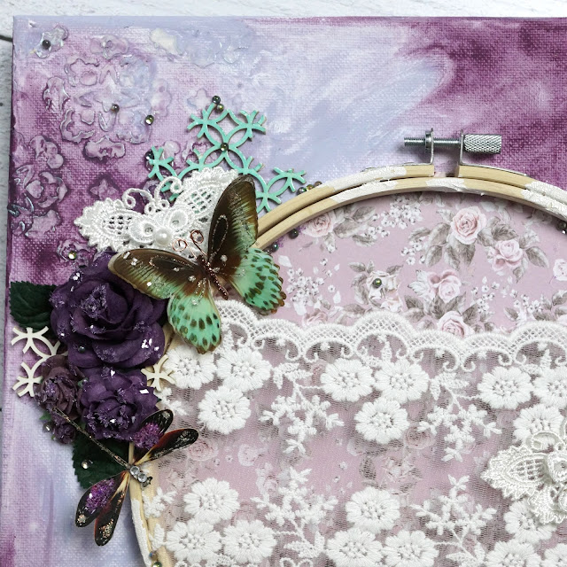 Mixed Media canvas made with: Reneabouquets beautiful board chipboard, lace, butterflies, dragonflies, printed beautiful board hummingbird, paper flowers, gawdie girl glitter glass, and beautiful beads; Prima Marketing Finnabair impasto paint; Scrapbook.com stencil; Tim Holtz salvaged patina embossing glaze