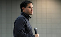 Republican U.S. presidential candidate Senator Marco Rubio listens to a question during a town hall meeting in Waterloo, Iowa, December 29, 2015. 95% of economics experts disagree with Rubio’s claims that cutting carbon pollution will hurt the economy. (Photograph Credit: Scott Morgan/Reuters) Click to Enlarge.