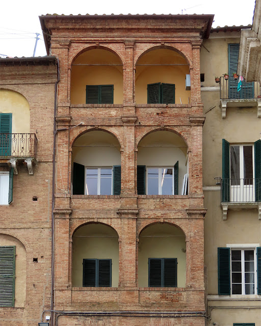 Vaulted balconies, Piazza Provenzano, Siena