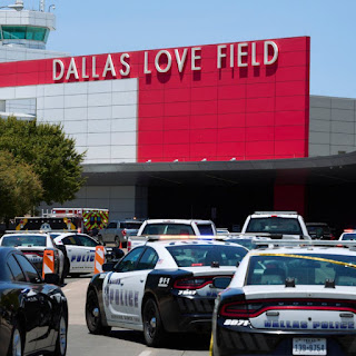 Dallas Love Field shooting leaves a woman wounded and in custody.