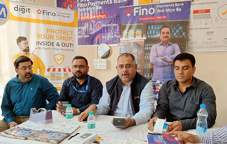 Vishal Gandotra, Zonal Head, Rajneesh Srivastav (Regional Head) Fino Payments Bank, along with Akshay Ahuja (Cluster Head) and other team members of Fino Bank during launch of shop insurance policy in Ludhiana on June 15, 2022