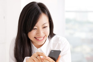 Woman searching for local information on her smartphone