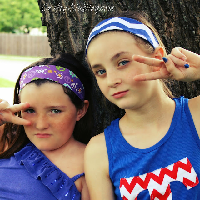 girls posing in fabric headbands peace sign