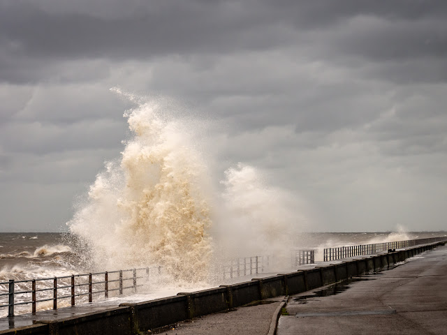 Photo of a giant wave smashing against Maryport Promenade at the tail end of Storm Hector