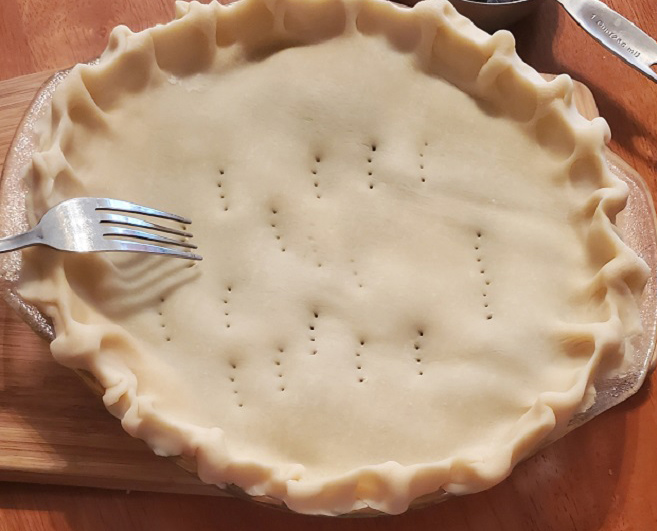 homemade pie crust with holes poked on top