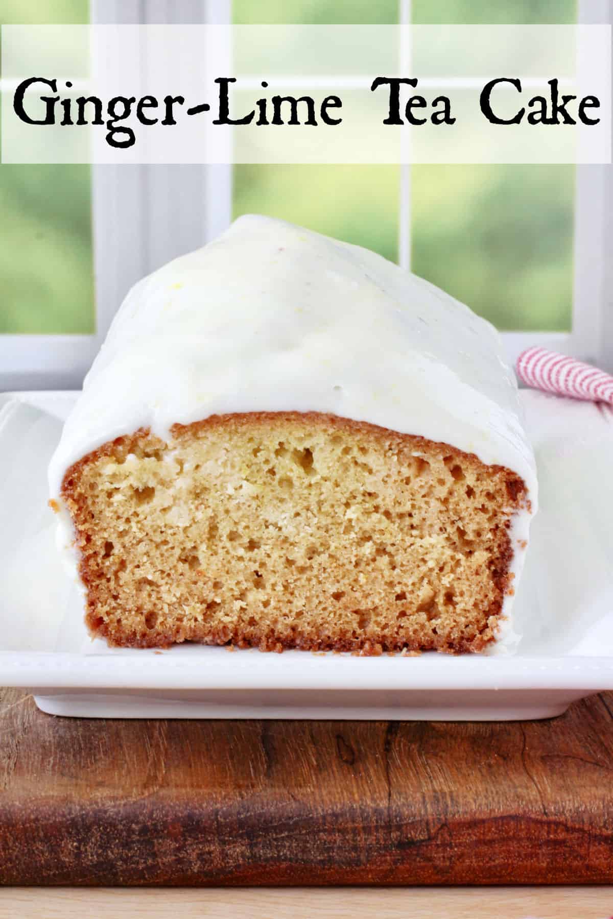 Ginger-Lime Tea Cake loaf on a plate.