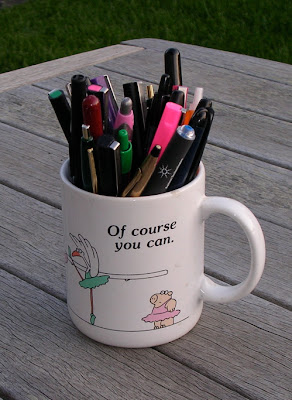 Sandra Boynton mug filled with pens