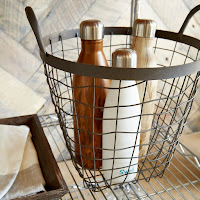 Decorative storage idea with baskets made from wrought iron