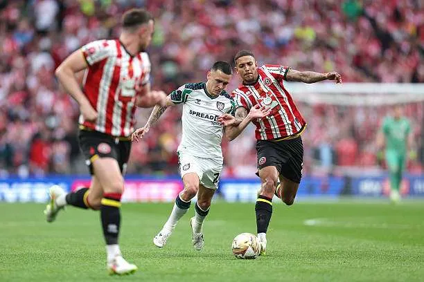 Enzo Le Fée of Sunderland and Vinícius Souza of Sheffield United in action during the Sky Bet Championship Play-Off Final at Wembley Stadium on May 24, 2025, in London, England. Photo by Charlotte Wilson/Offside