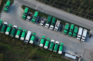green and white trucks parked and spotted from the dudek synthesis in Sydney