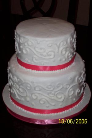 Picture of Coral Ribbon Wedding Cake by Creative Cakes by Sabrina