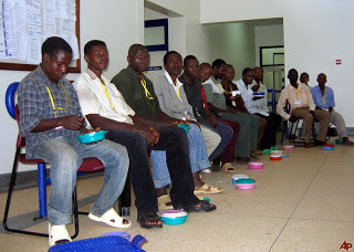 African men wait to learn about circumcision