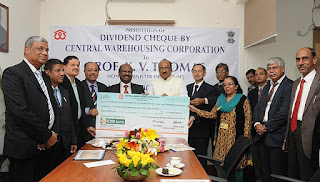 The Minister of State (Independent Charge) for Consumer Affairs, Food and Public Distribution, Professor K.V. Thomas receiving a dividend cheque from the Chairman, Central Warehousing Corporation, Dr. C.V. Ananda Bose by Government of India on Wikimedia Commons -https://commons.wikimedia.org/wiki/File:The_Minister_of_State_(Independent_Charge)_for_Consumer_Affairs,_Food_and_Public_Distribution,_Professor_K.V._Thomas_receiving_a_dividend_cheque_from_the_Chairman,_Central_Warehousing_Corporation,_Dr._C.V._Ananda_Bose.jpg