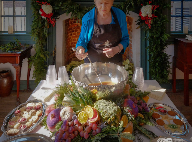 Lady serving wassail at Cupola House in Edenton, NC