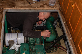 Photo of Phil refitting the exhaust elbow