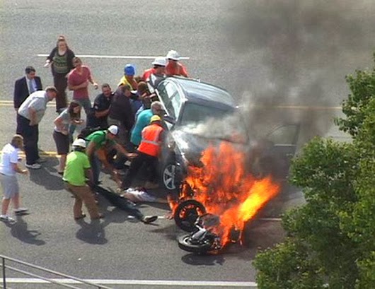 When these bystanders joined forces to literally lift a car off of a trapped motorcyclist.