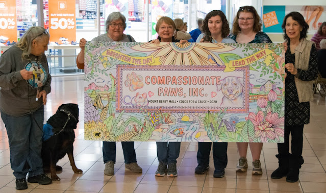 Compassionate Paws with the winner banner for color for a cause