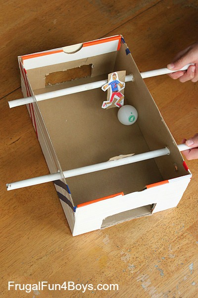 http://frugalfun4boys.com/2014/06/29/make-shoebox-foosball-game/