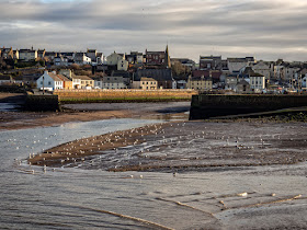 Photo of Maryport from across the basin as the tide comes in