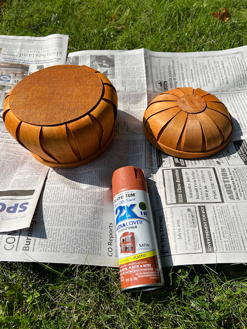 Photo of a basket pumpkin being spray painted.