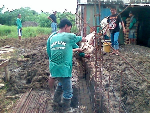 "Padugo" - Filipino ritual of pouring the chicken blood in every footing corner