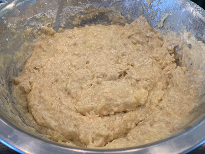 Banana Muffin mixture in a silver bowl