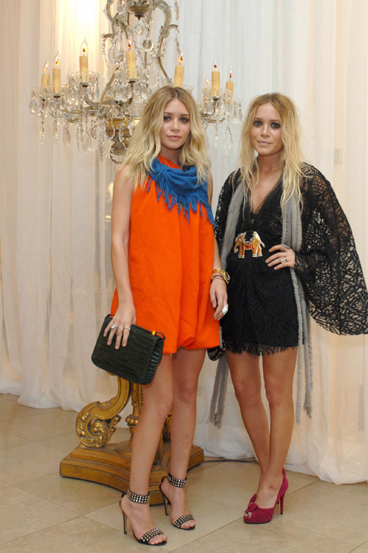 MaryKate and Ashley Olsen will work on the cash registers at the launch of