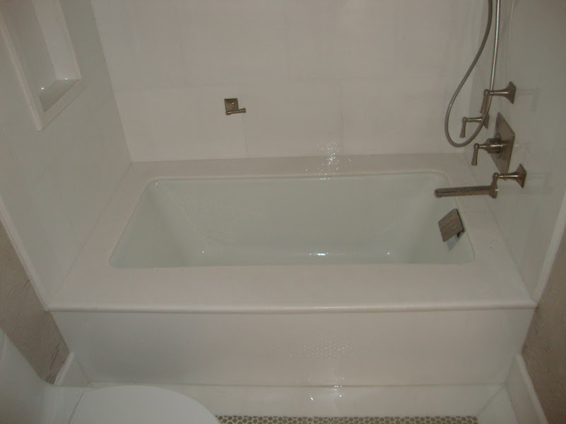 Guest Bathroom in White Thassos Brick Pattern, Green Glass Tile, and  title=