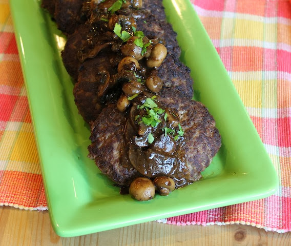 Food Lust People Love: Pan-fried ground beef patties seasoned with onions and beef stock cubes make a wonderful budget meal, especially smothered in homemade mushroom gravy.