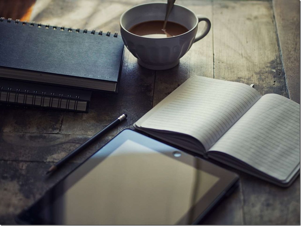 Tea with diary writing digital journal