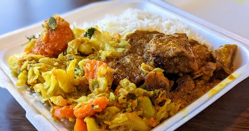 Lamb curry and vegetables with rice