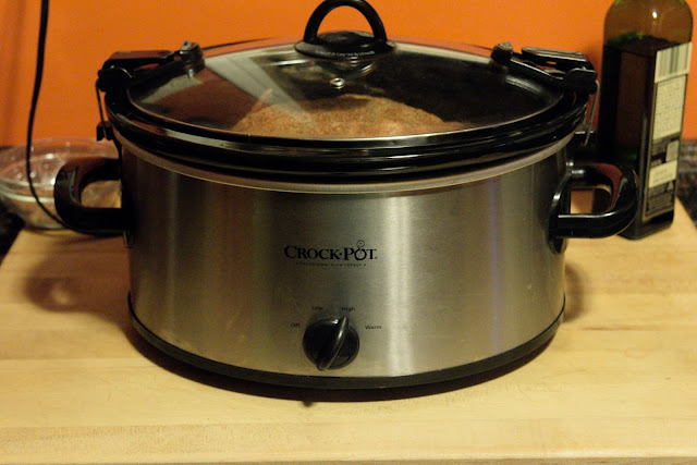 The crock pot on the counted, with the lid on, turned to HIGH.