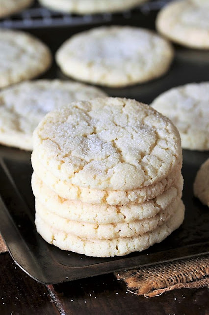 Stack of Soft & Chewy Sugar Cookies on Baking Sheet Image